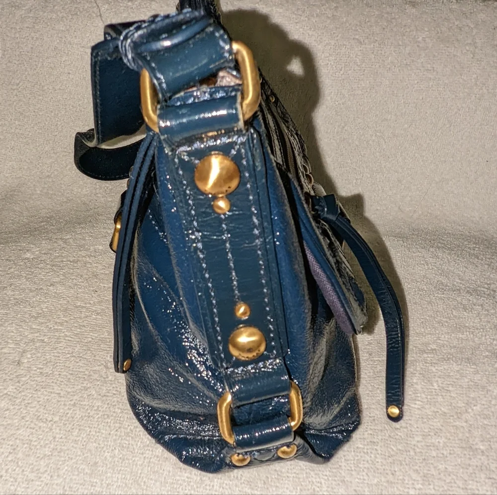 The  Sak navy blue patent leather hobo bag.